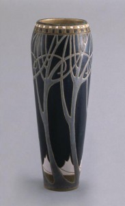 Once again, Frederick Rhead demonstrates his ability to unify form and design in this 12-inch vase wrapped with an incised pattern of winter trees, made circa 1911 during his residence in University City.